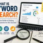 Keyword research SEO feature image showing a laptop with keyword analytics dashboard, search volume charts, keyword difficulty metrics, and SEO planning notes. A magnifying glass highlights keyword strategy while icons represent keyword discovery